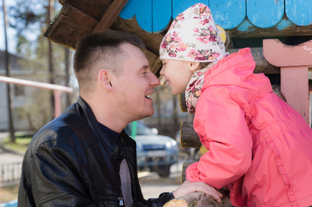 Father and daughter look at each other.の写真素材