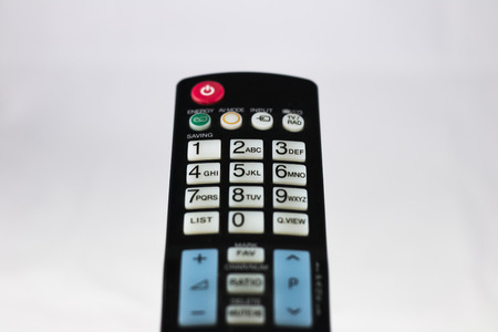 The television remote control on the white background の写真素材
