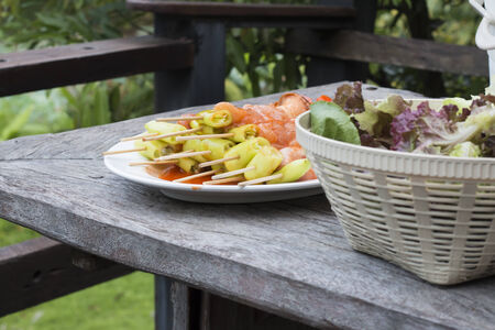 Barbecue on dish with salad vegetable の写真素材