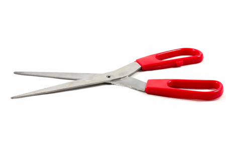 Red scissors on the white backgroungの写真素材