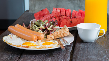 American breakfast set with orange juice and watermelon.の写真素材