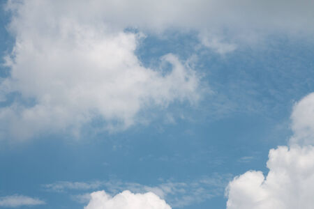 blue sky background with white cloudsの写真素材