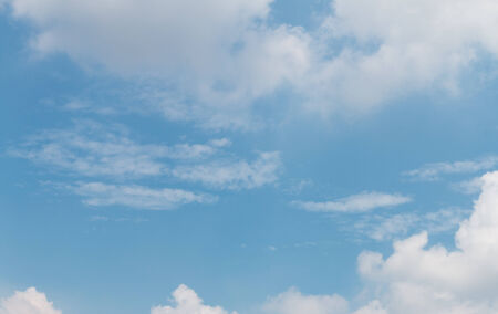 blue sky background with white cloudsの写真素材