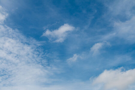 Blue sky with clouds background.の写真素材