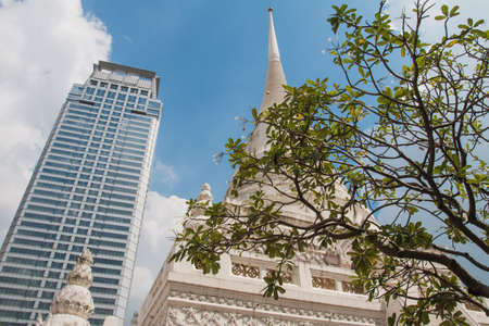 Old pagoda in modern cityの写真素材