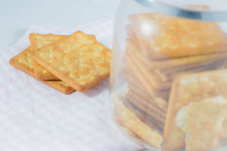 Crackers on napkin with jar.の写真素材