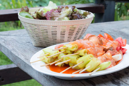 Barbecue on dish with salad vegetable.の写真素材