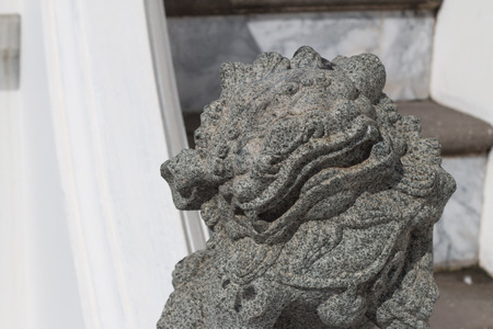 Stone lion in Thai temple.の写真素材