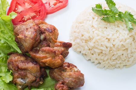 Fried chicken with salt and brown riceの写真素材