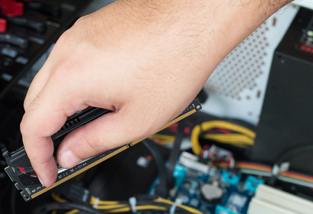 The technician is fixing computer.の写真素材