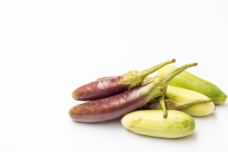 Purple eggplant and cucumber isolated on white background.の写真素材