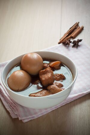 Eggs and pork in brown sauce,Thai food.の写真素材