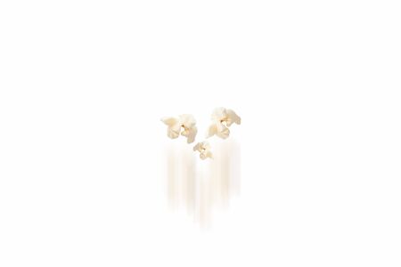 Pop corn on white background with motion blur.の写真素材