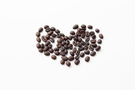 Heart from coffee beans, isolated on whiteの写真素材