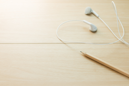 Pencil and earphone in vitage style with soft focus,music concept.の写真素材