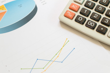 Financial graphs with calculator,Business concept.の写真素材