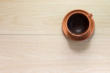 Vintage coffee cup empty on wooden table,From above.の写真素材