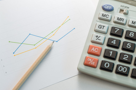 Financial graphs with calculator,Business concept.の写真素材