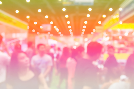 Blur people in a exhibition hall with color filter.の写真素材