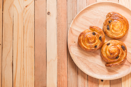 Top view of cinnamon and raisin roll bun,still life style from above.の写真素材