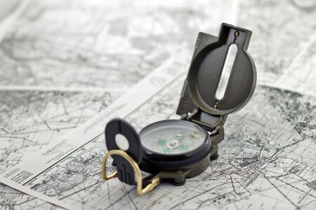 compass on the background black-and-white city maps 