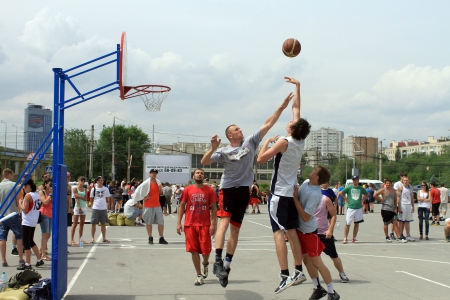 VOLGOGRAD, RUSSIA - MAY 26: Young people play in streetball on the open area located next to the \"dancing\" bridge. Annual streetball party organized Europa city Mall, on may 26, 2013 in Volgogradのeditorial素材