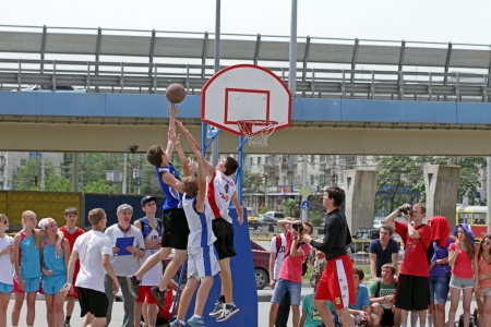 VOLGOGRAD, RUSSIA - MAY 26: Young people play in streetball on the open area located next to the \"dancing\" bridge. Annual streetball party organized Europa city Mall, on may 26, 2013 in Volgogradのeditorial素材