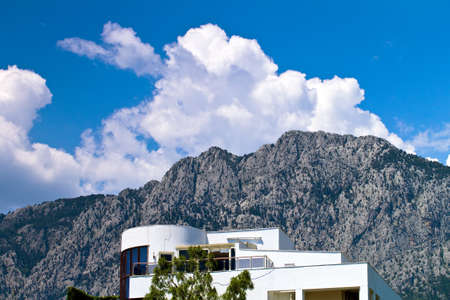 building on the background of mountains and cloudsのeditorial素材