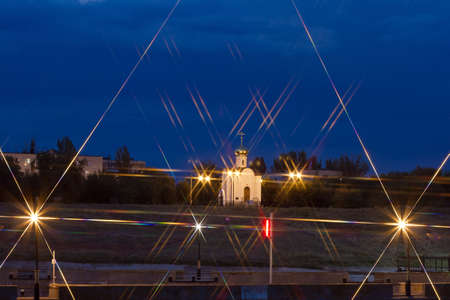 A small Church with night illumination  Lights and star filterの写真素材