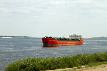 Barge Sprinter Caspian is anchored near the shore of the Volga river  のeditorial素材
