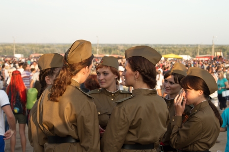 VOLGOGRAD, RUSSIA - AUGUST 23   Girls policemen in soldier s uniform of the great Patriotic war in the crowd on the international bike show  August 23, 2013 in Volgograd, Russia のeditorial素材