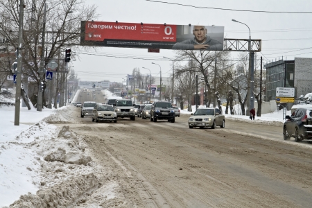 VOLGOGRAD - DECEMBER 12 City road cleared from snow  Movement is restored, but difficult    December 12, 2013 in Volgograd, Russia のeditorial素材
