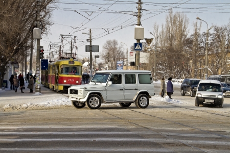 VOLGOGRAD - DECEMBER 12 at the crossroads in the snow-covered city  Tram stop street of Marshal Rokossovsky   December 12, 2013 in Volgograd, Russia のeditorial素材