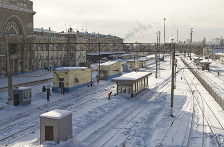  VOLGOGRAD - DECEMBER 12  cleaning snow from the railway tracks Central station  december 12, 2013 in Volgograd, Russia のeditorial素材