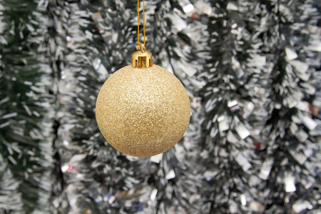 The Golden ball against of new year s tinselの写真素材
