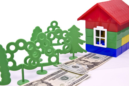 toy trees , monetary alley in front of a small houseの写真素材