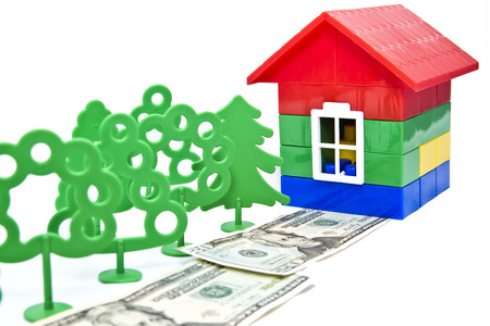 toy trees , monetary alley in front of a small houseの写真素材