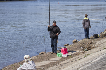 VOLGOGRAD - APRIL 27  Fishermens catch fish at entrance to the Volga-don navigation canal   April 27, 2014 in Volgograd, Russia In first warm spring weekend residents of city opened fishing season のeditorial素材