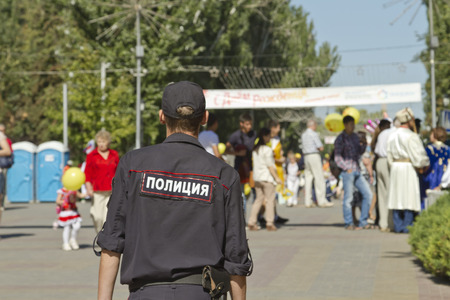 VOLGOGRAD - SEPTEMBER 6: Police outfit keeps order and security during the celebration of city day. September 6, 2014 in Volgograd, Russia.のeditorial素材