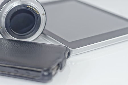 cell phone, lens for SLR camera and tablet PCの写真素材