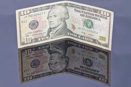 banknote one dollar on a reflective surfaceの写真素材
