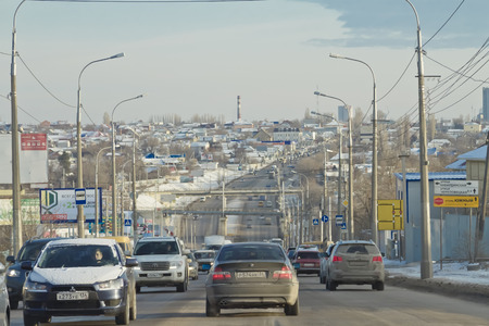 VOLGOGRAD - DECEMBER 29: The flow of cars moving towards the city centre along the street the second longitudinal. December 29, 2014 in Volgograd, Russia.のeditorial素材