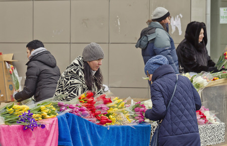 VOLGOGRAD - MARCH 8:Selling flowers at a makeshift flower markets on the eve of international women\'s day.  March 8, 2015 in Volgograd, Russia.のeditorial素材