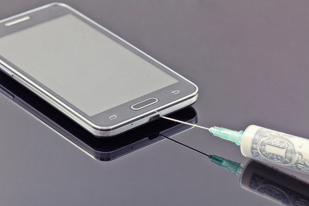 payment provider. Depositing a mobile phone to pay for online gamesの写真素材