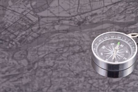 the compass on the background of the reflection mapsの写真素材