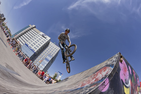 VOLGOGRAD - MAY 24: The BMX cyclist performs a stunt jump. The fifth annual competition for the Cup of Europe city Mall . May 24, 2015 in Volgograd, Russia.のeditorial素材