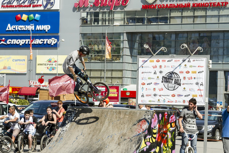 VOLGOGRAD - MAY 24: The BMX cyclist performs a stunt jump. The fifth annual competition for the Cup of Europe city Mall . May 24, 2015 in Volgograd, Russia.のeditorial素材