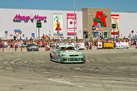 VOLGOGRAD - JUNE 6: Drift car team X-Round enters the bend with slip during demonstrations as part of the tour on cities of Russia "Thank you for the victory!". June 6, 2015 in Volgograd, Russia.のeditorial素材
