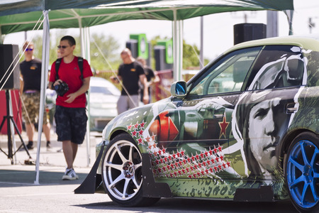 VOLGOGRAD - JUNE 6: Specially designed for drifting machine stylized military themes during a speech at the auto show. June 6, 2015 in Volgograd, Russia.のeditorial素材