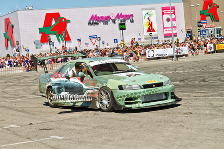 VOLGOGRAD - JUNE 6: Specially designed for drifting machine stylized military themes during a speech at the auto show. June 6, 2015 in Volgograd, Russia.のeditorial素材
